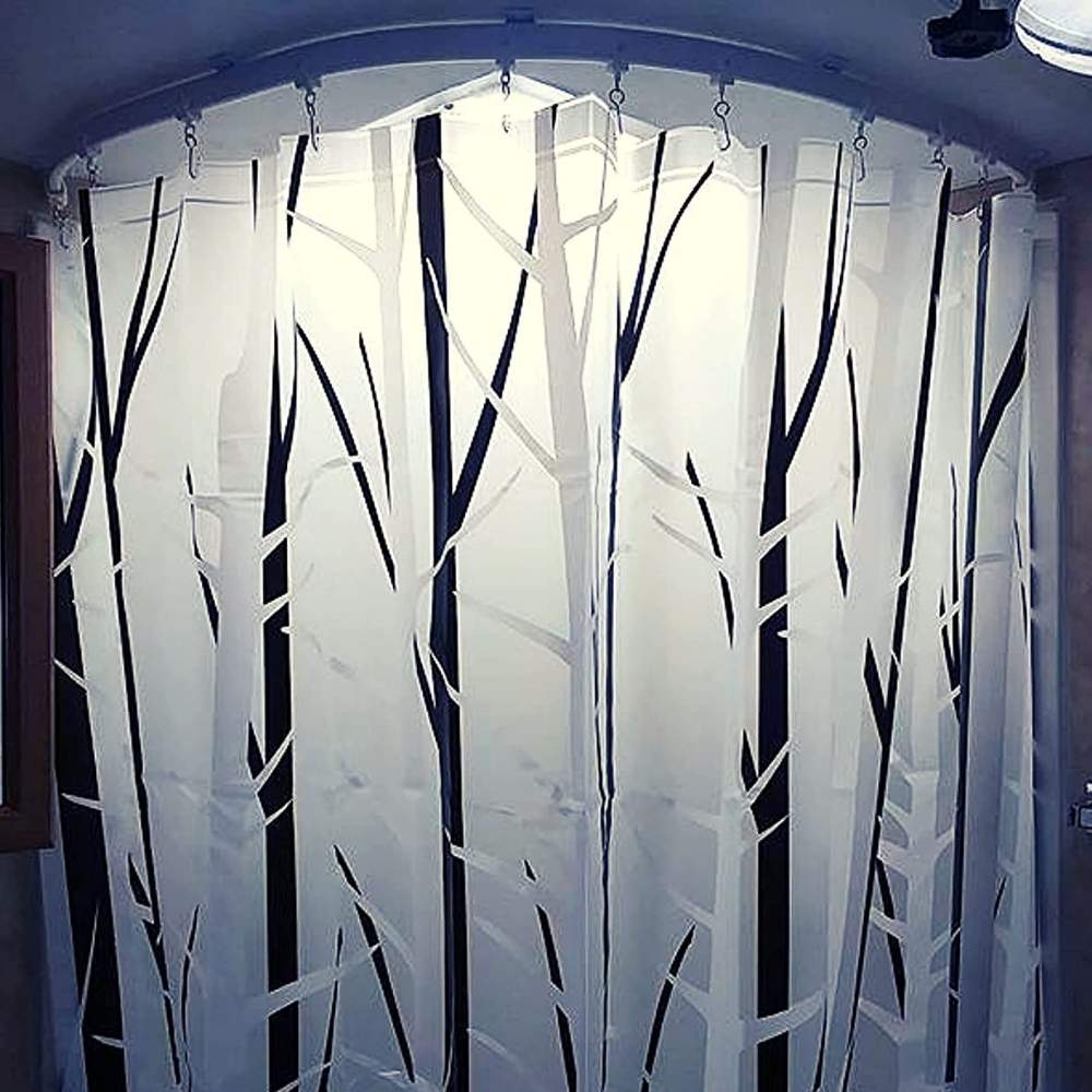 Ceiling mounted curtain rail used in a bathroom shower space